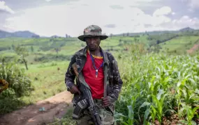 A rebel fighter stands guard in 2018 in Rutshuru territory. More than 120 armed groups are active in eastern parts of the country. 